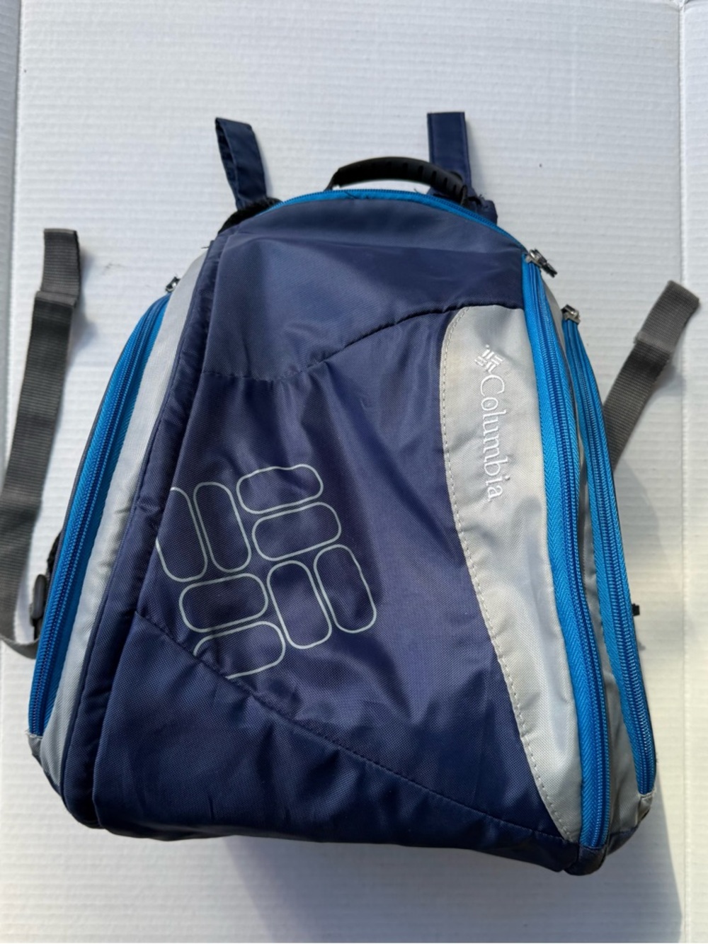 Columbia Navy Blue Backpack with Light Gray Panels and Bright Blue Zippers